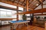 This stunning property boasts a rustic, yet modern design with exposed wooden beams and a spacious layout.
