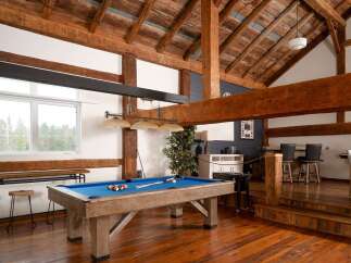 This stunning property boasts a rustic, yet modern design with exposed wooden beams and a spacious layout.