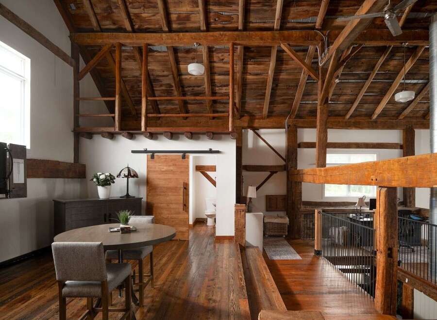 Experience rustic elegance in this stunning property! Featuring exposed wooden beams, a loft area, and a stylish sliding barn door, this home seamlessly blends modern design with a touch of countryside charm.