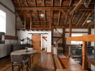 Experience rustic elegance in this stunning property! Featuring exposed wooden beams, a loft area, and a stylish sliding barn door, this home seamlessly blends modern design with a touch of countryside charm.