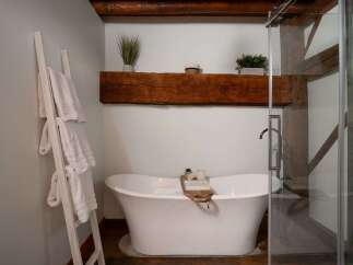 Indulge in the luxury of this stunning bathroom, featuring a freestanding bathtub and a spa-like ambiance.