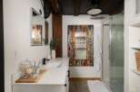 Step into a bathroom oasis with this stunning property! Featuring a unique, colorful mosaic mirror, this space exudes artistic charm.