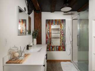 Step into a bathroom oasis with this stunning property! Featuring a unique, colorful mosaic mirror, this space exudes artistic charm.