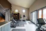 This spacious home gym offers a dedicated space for fitness enthusiasts.