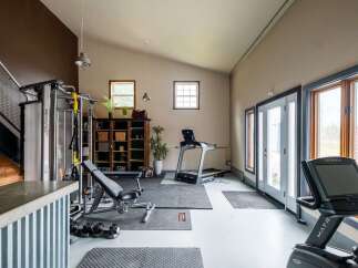 This spacious home gym offers a dedicated space for fitness enthusiasts.