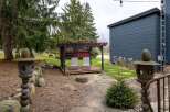 Enjoy the tranquility of this outdoor oasis! This property features a charming pergola with seating, perfect for relaxing or entertaining.