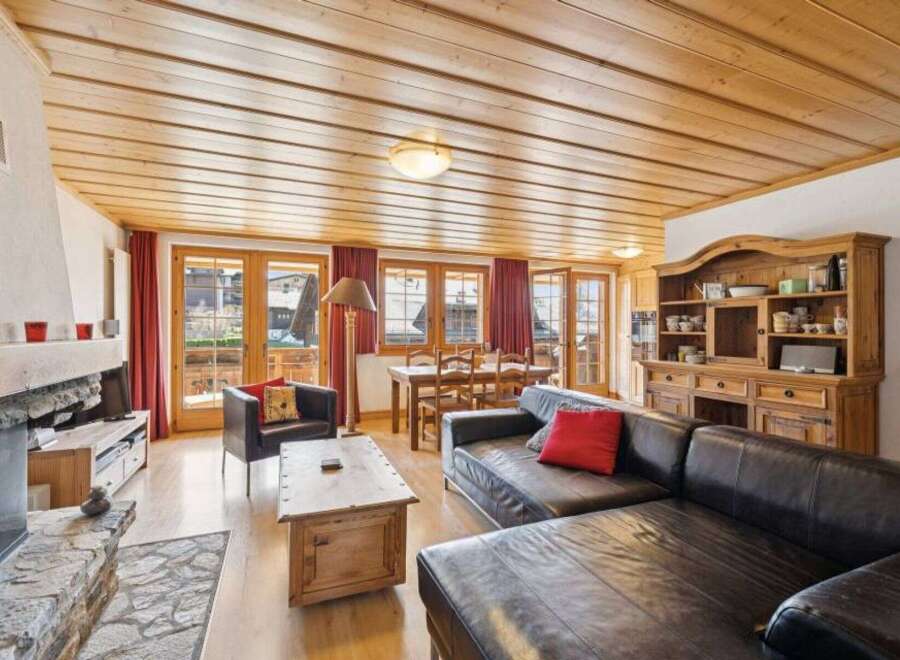 Step into a cozy living space with a rustic charm.