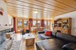 Step into a cozy living space with a rustic charm.