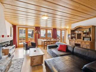 Step into a cozy living space with a rustic charm.