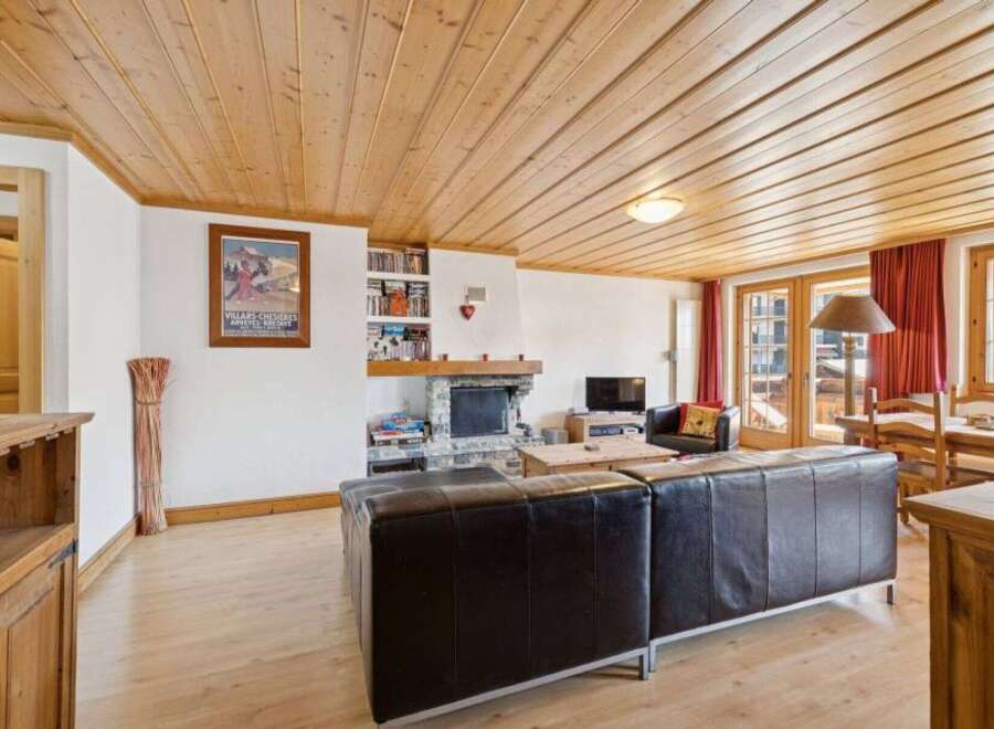 This stunning property boasts a cozy living room with a fireplace, perfect for relaxing evenings.