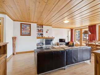 This stunning property boasts a cozy living room with a fireplace, perfect for relaxing evenings.