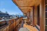 Enjoy breathtaking mountain views from this charming balcony.