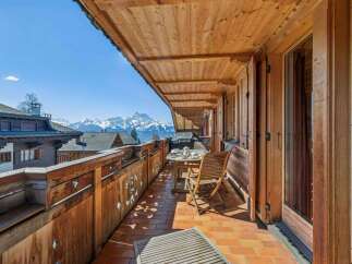 Enjoy breathtaking mountain views from this charming balcony.