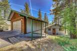 Nestled amidst towering trees, this charming property offers a serene escape.