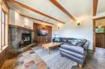 Step into luxury with this stunning living room featuring a cozy fireplace and a sleek, modern design.