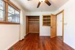 Step into this inviting bedroom featuring beautiful hardwood floors and ample natural light.
