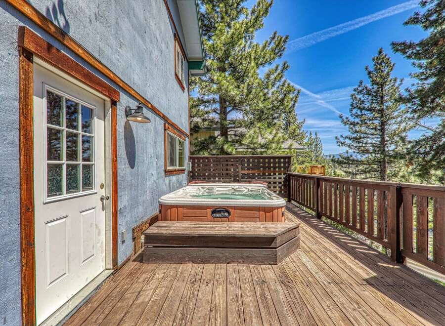 Relax and unwind in this stunning property featuring a luxurious hot tub on a spacious deck.
