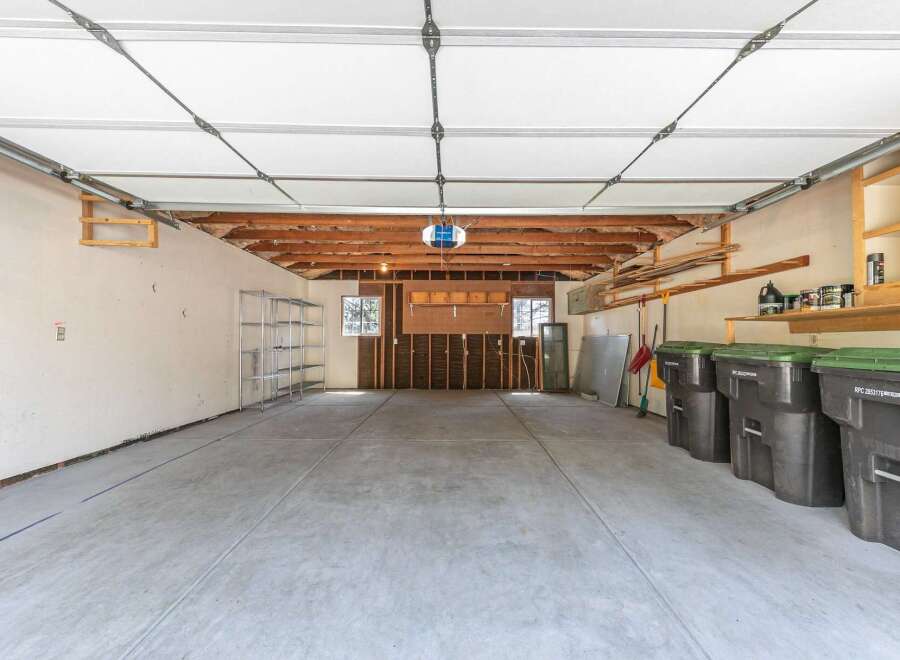 Discover the potential of this spacious garage, perfect for storage or a workshop.