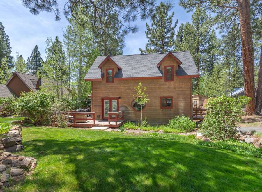 Nestled amidst lush greenery, this charming cabin offers a serene escape.