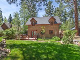 Nestled amidst lush greenery, this charming cabin offers a serene escape.