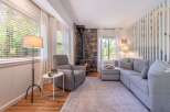 Step into a cozy living space featuring a stunning stone fireplace, perfect for those chilly evenings.