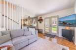 Step into this inviting living space, perfect for relaxation and entertaining.