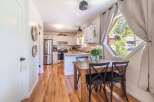 Step into this charming kitchen and dining area, perfect for creating lasting memories.