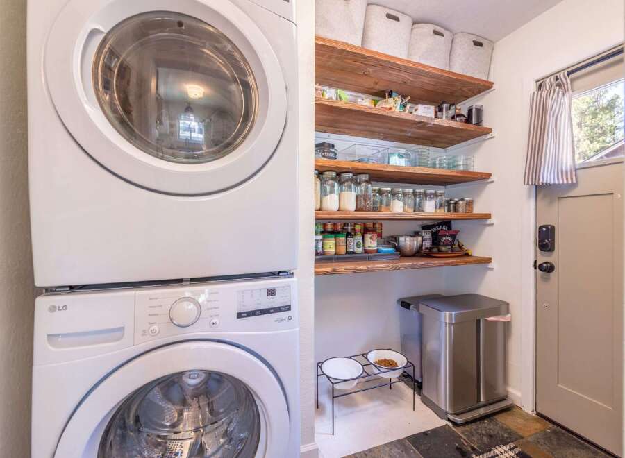 This charming home boasts a convenient laundry area with a modern LG washer and dryer.