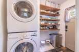 This charming home boasts a convenient laundry area with a modern LG washer and dryer.