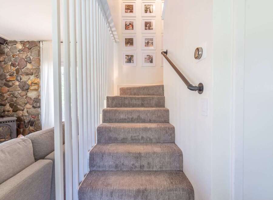 Step into this inviting home and be greeted by a cozy staircase.