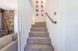 Step into this inviting home and be greeted by a cozy staircase.
