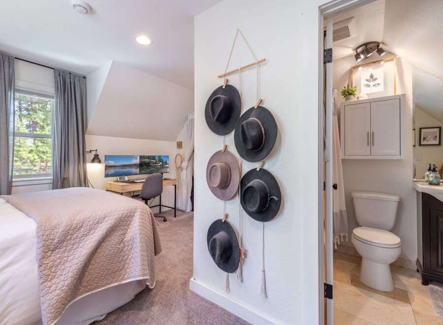 This charming bedroom offers a cozy retreat with its inviting ambiance and stylish decor.