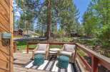 Enjoy the tranquility of this outdoor oasis! This property features a charming deck with comfortable seating, perfect for relaxing or entertaining.