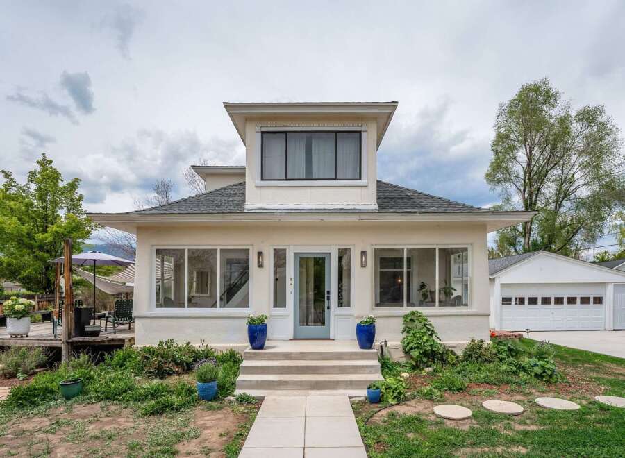 This charming home boasts a beautiful exterior with a welcoming entrance.