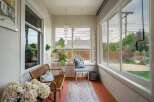 Step into this charming sunroom, perfect for relaxation and enjoying natural light.