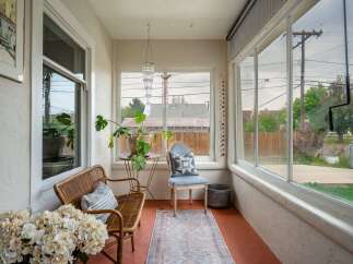 Step into this charming sunroom, perfect for relaxation and enjoying natural light.
