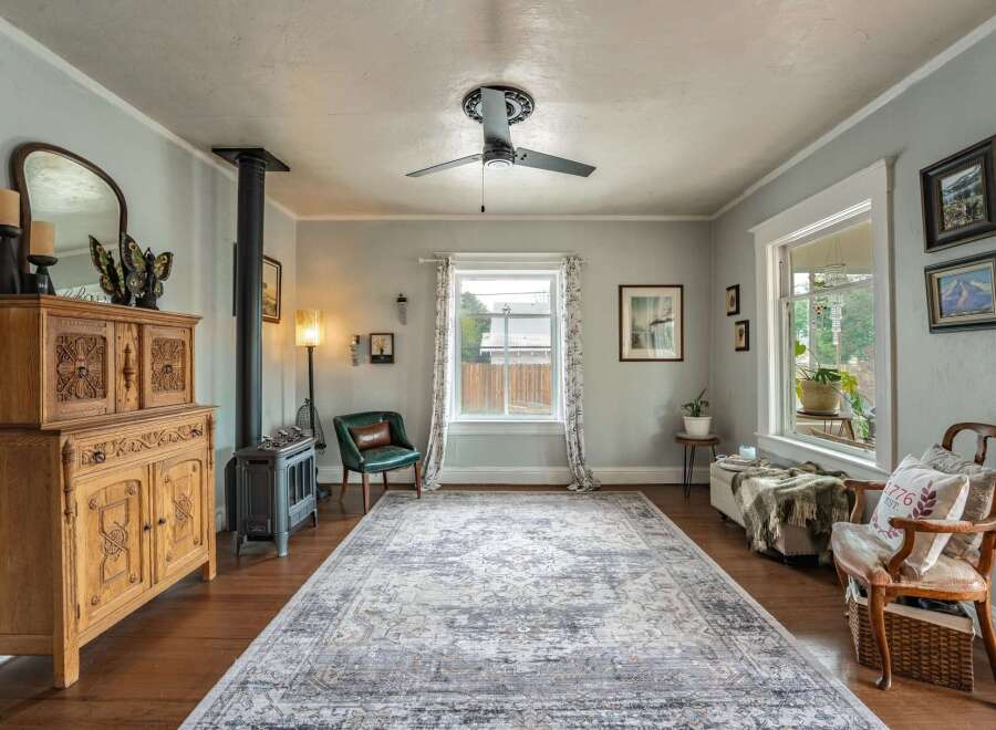 Step into this inviting living space, featuring a cozy ambiance with a vintage-inspired aesthetic.