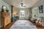 Step into this inviting living space, featuring a cozy ambiance with a vintage-inspired aesthetic.
