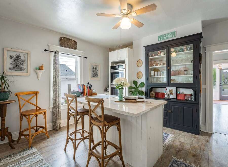 This charming kitchen boasts a bright and airy atmosphere, perfect for culinary adventures.