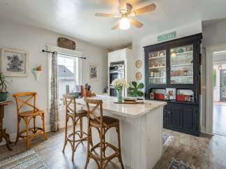 This charming kitchen boasts a bright and airy atmosphere, perfect for culinary adventures.