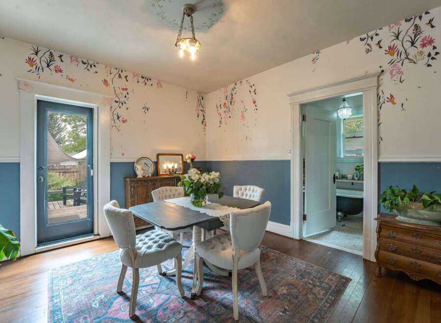 Step into this charming dining room, featuring a unique blend of vintage and modern design.