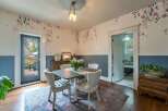 Step into this charming dining room, featuring a unique blend of vintage and modern design.