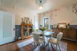 Step into this charming dining room, perfect for hosting intimate gatherings.