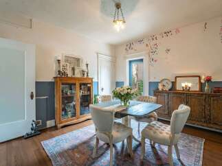 Step into this charming dining room, perfect for hosting intimate gatherings.