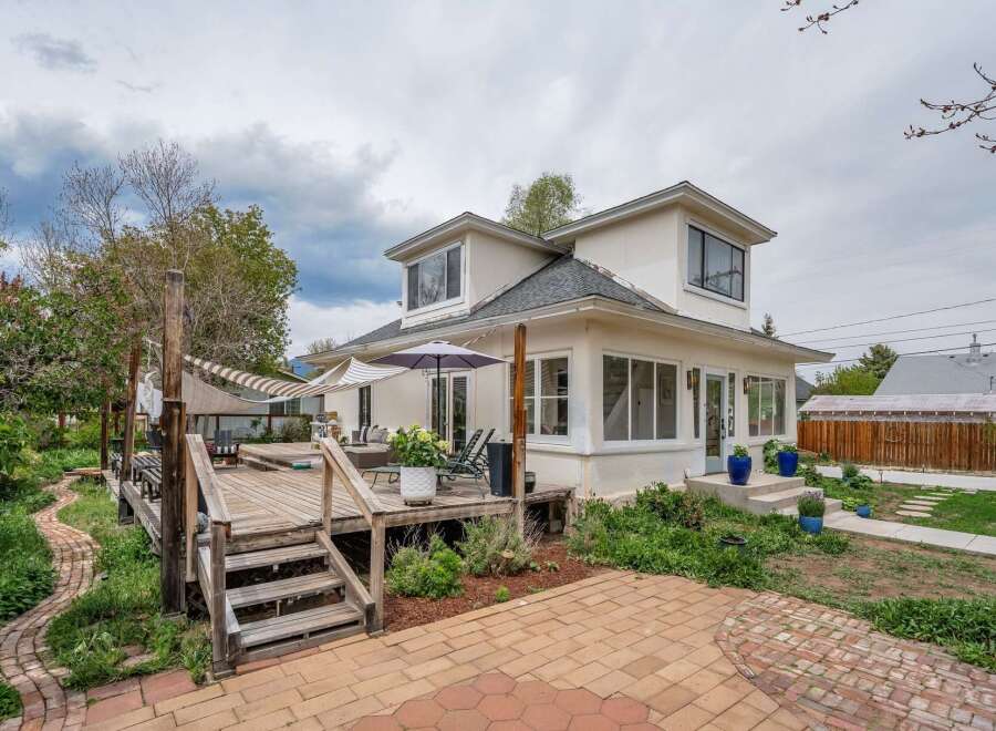 This stunning property boasts a spacious deck, perfect for outdoor entertaining and relaxation.