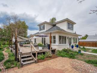 This stunning property boasts a spacious deck, perfect for outdoor entertaining and relaxation.