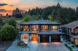 This stunning two-story home boasts a modern design with a beautiful exterior.