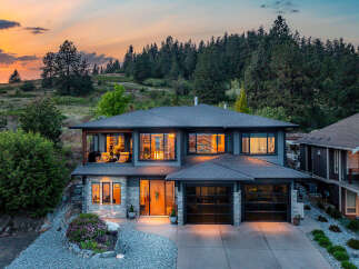 This stunning two-story home boasts a modern design with a beautiful exterior.