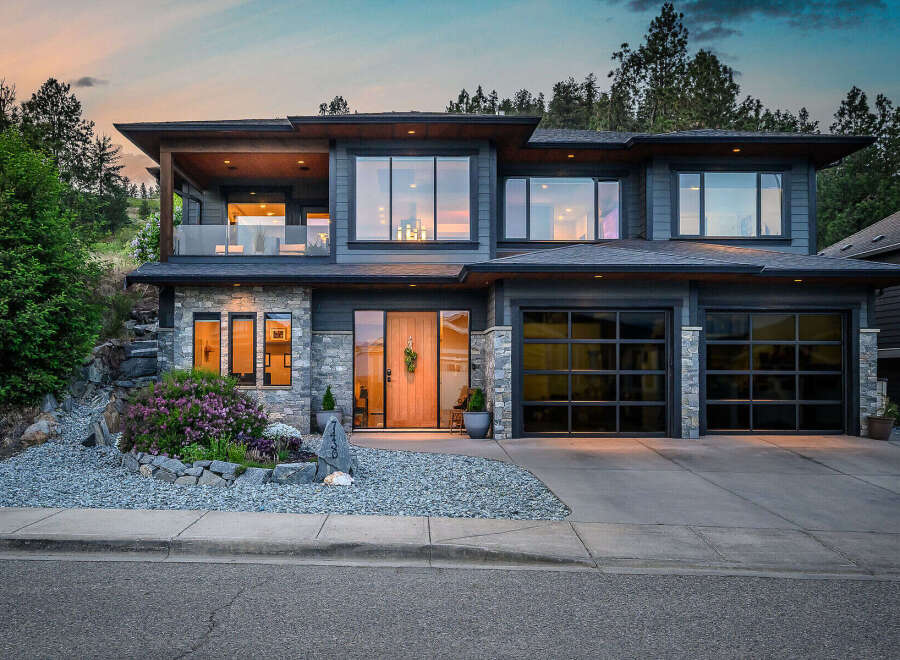 This stunning modern home boasts a sleek design with a beautiful facade.