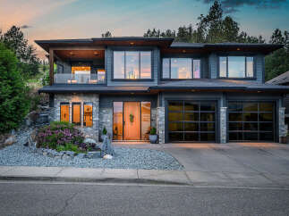 This stunning modern home boasts a sleek design with a beautiful facade.